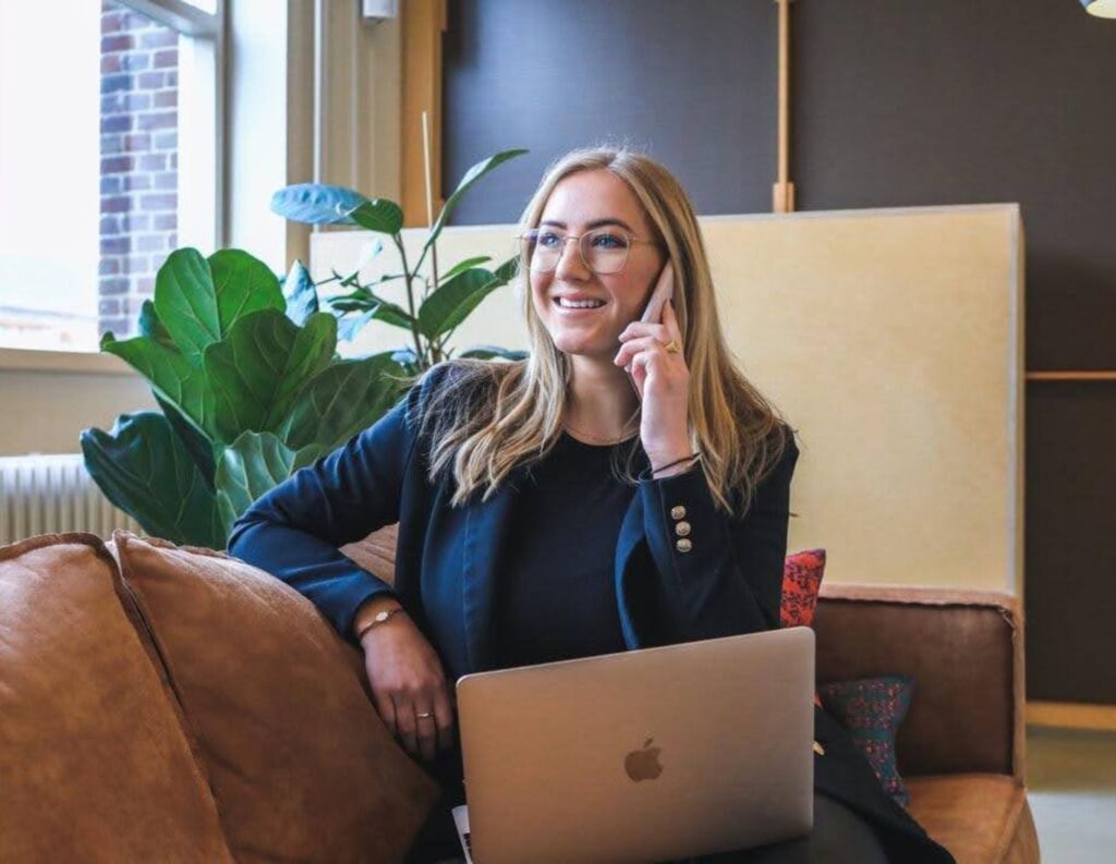 Woman conducting consultative selling on the phone